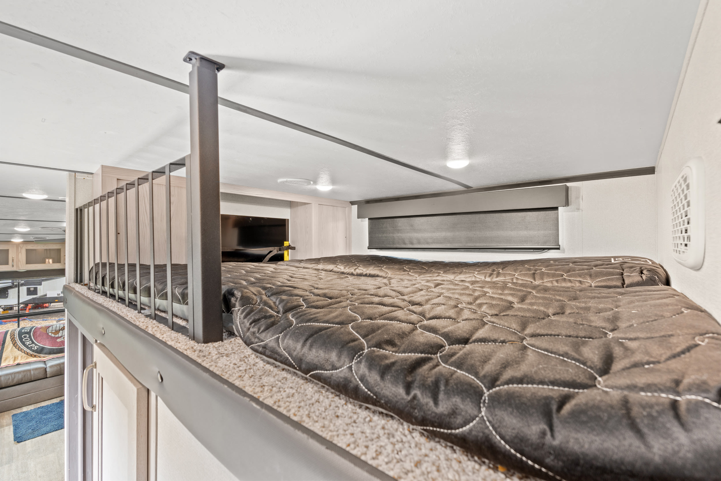 Step up to comfort! This rv rental features a spacious loft bunk bed with plush mattress and safety railing.. Keystone RV Montana High Country 2021