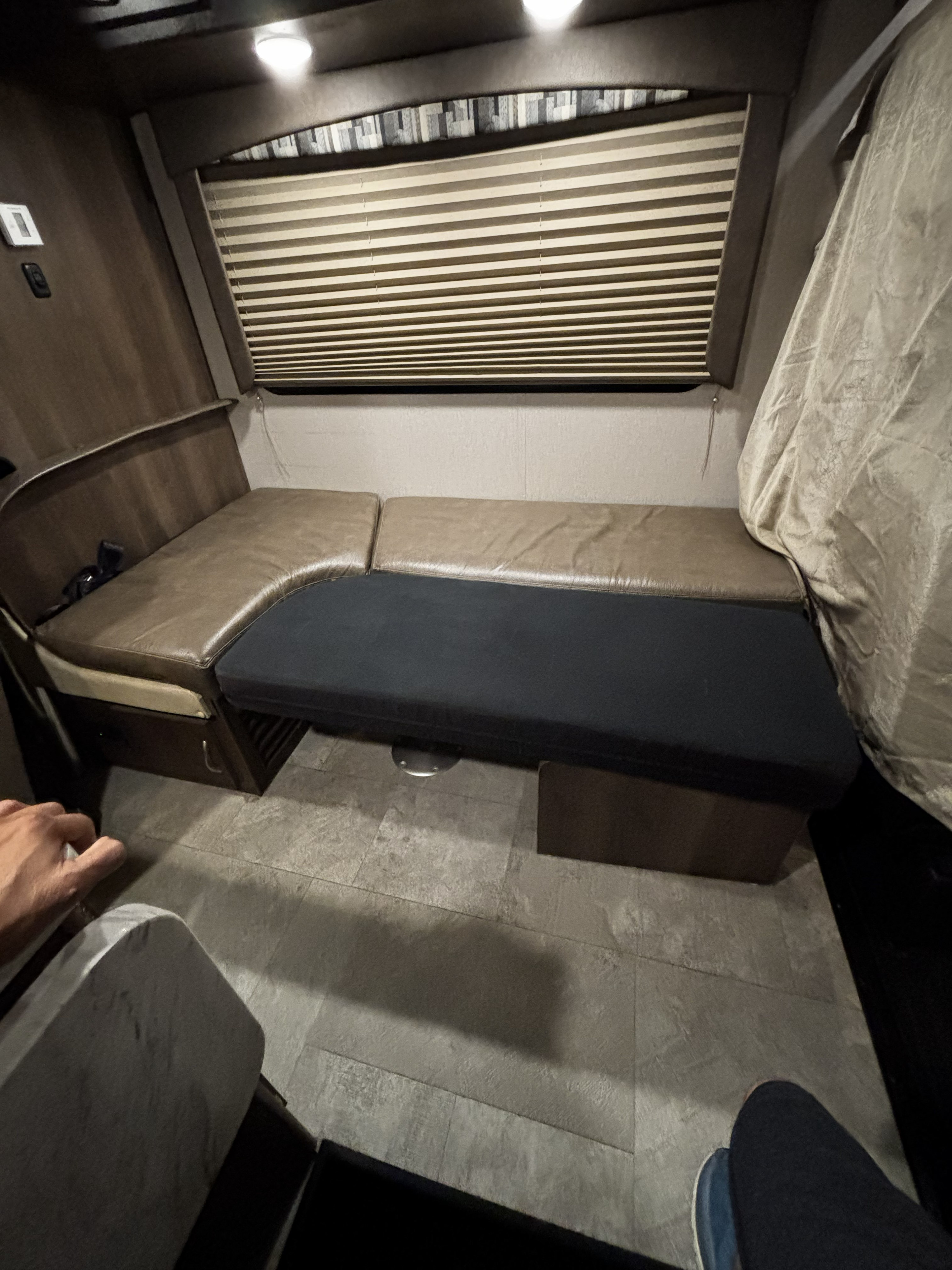 RV rental: U-shaped dinette with brown and dark cushions, window blinds, and tiled floor. Great for dining or relaxing.. Forest River Coachmen Orion 2019