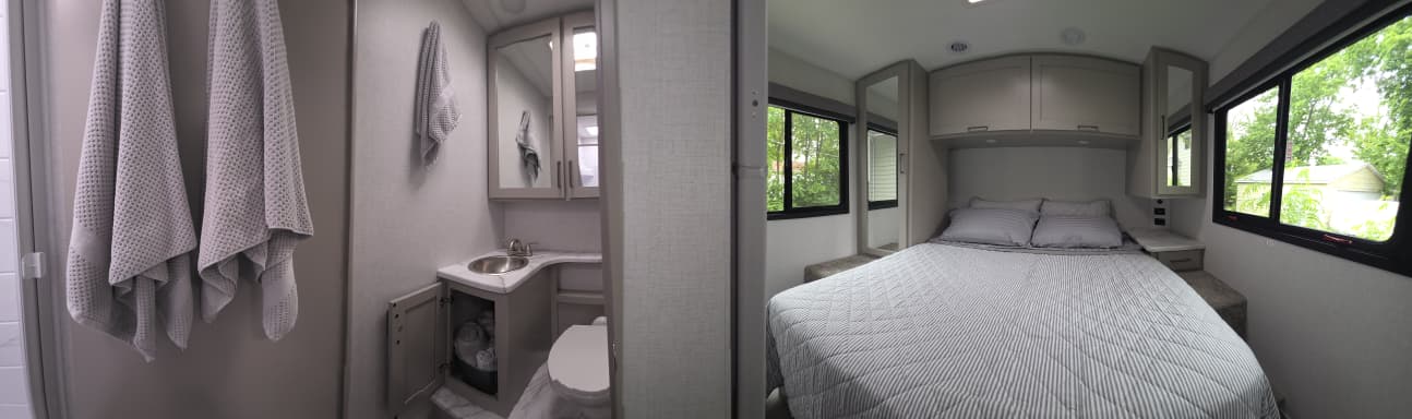 RV rental: Modern interior with a clean bathroom (sink, toilet, towels) and a comfy bedroom (bed, cabinets, windows).. Thor Coleman 2026