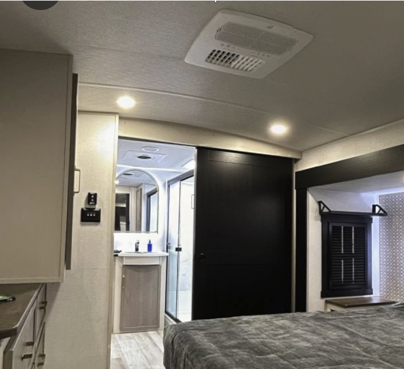 RV rental: Clean, modern bedroom with a comfy bed, en-suite bathroom, and overhead air conditioning for your travels.. Forest River Salem Hemisphere Elite 2025
