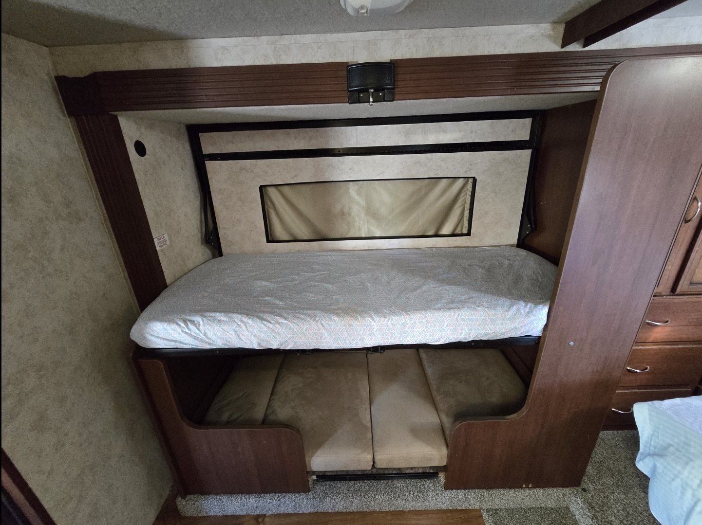 This RV rental features bunk beds, with a cozy upper bed and a convertible sofa/bed below for flexible sleeping arrangements.. Storm Storm Motorhome 2012