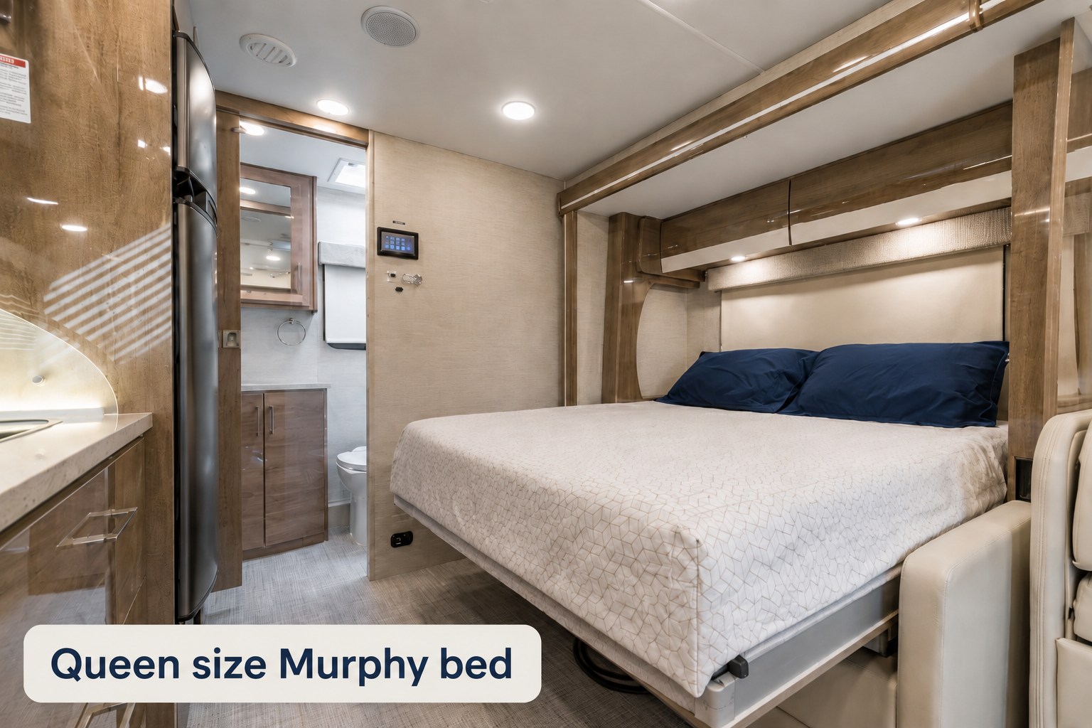 Comfortable RV rental interior featuring a queen-size Murphy bed, compact kitchen, and a convenient bathroom for your journey.. Entegra Coach Qwest 2021