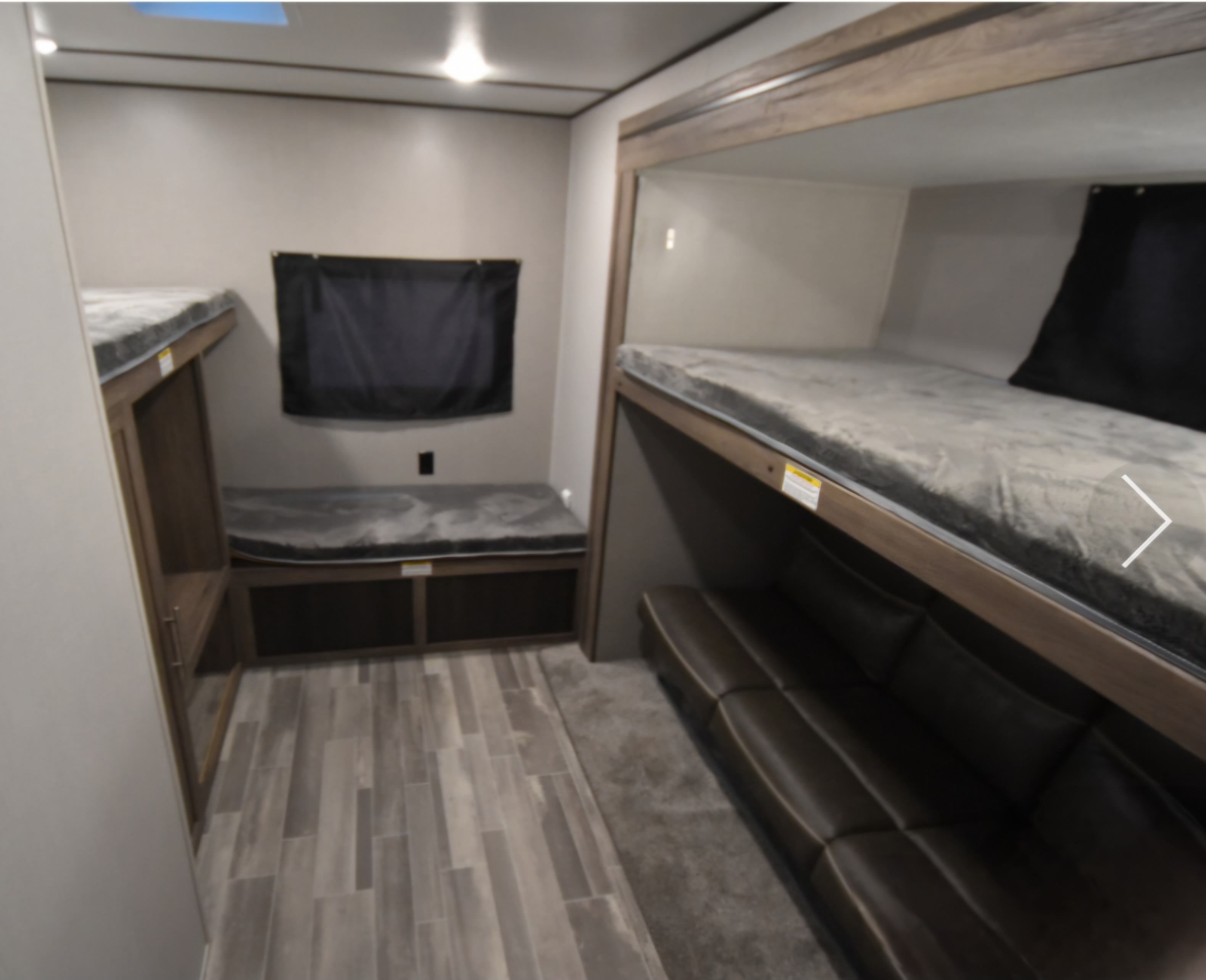 RV rental: Cozy bunk beds, a comfortable sofa, and a versatile bench with storage inside this modern interior.. Crossroads RV Zinger 2021