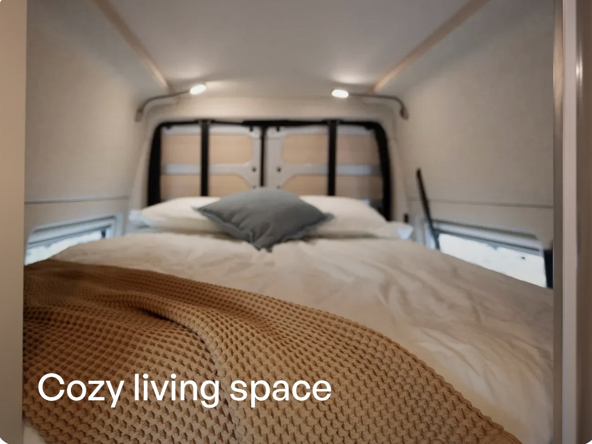 Cozy RV rental bedroom with warm blankets and pillows, ideal for van life adventures.. Noovo Noovo Plus LB 2026