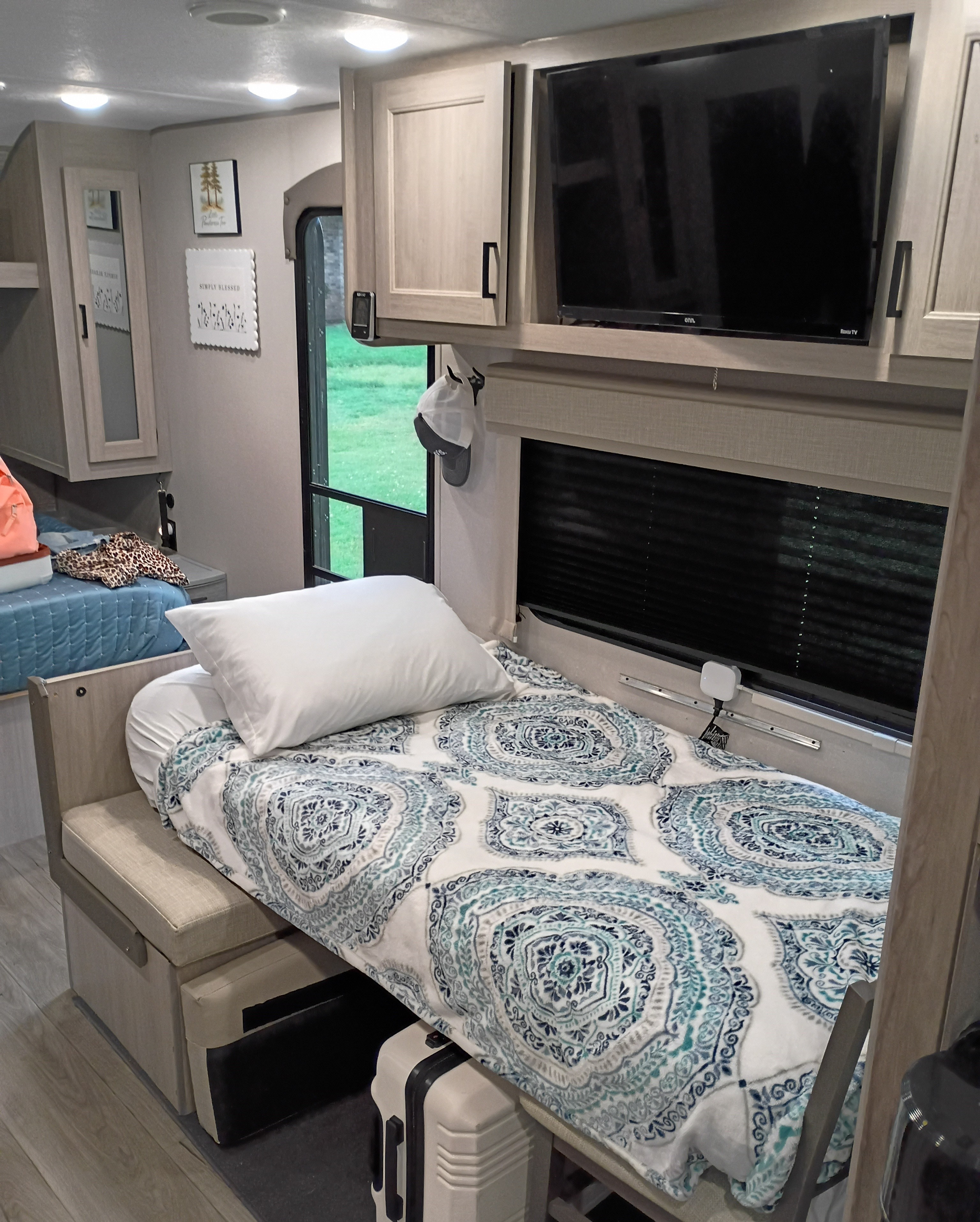 Cozy RV rental interior showing bunk beds, TV, and decorative touches. Perfect for comfortable travel adventures.. Coachmen Other 2025