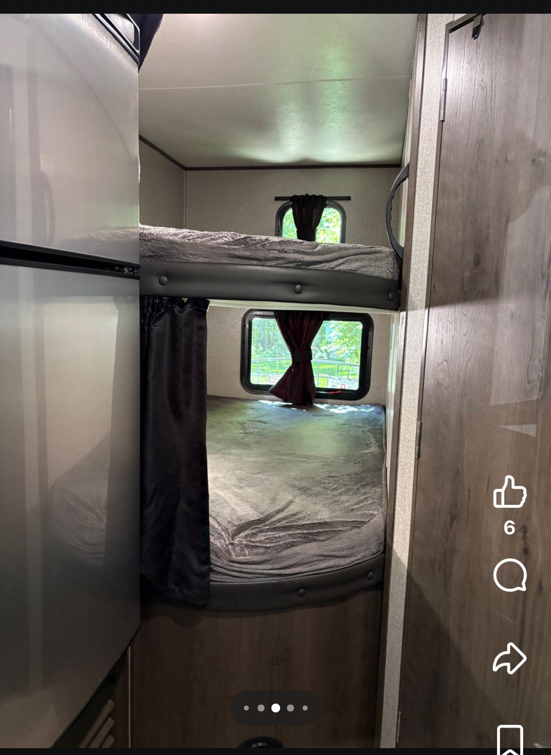 This RV rental's compact interior features two cozy bunk beds with windows and privacy curtains, perfect for extra sleeping space.. Jayco Jay Flight SLX 2021