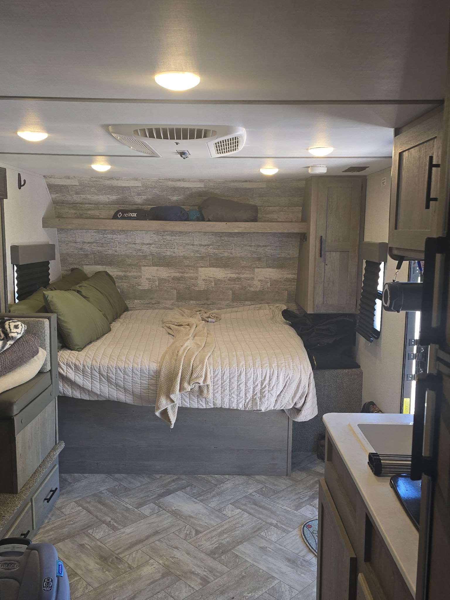 Cozy RV rental bedroom with a comfy bed, modern decor, and compact living space, perfect for your next road trip adventure.. Keystone RV Springdale 2021