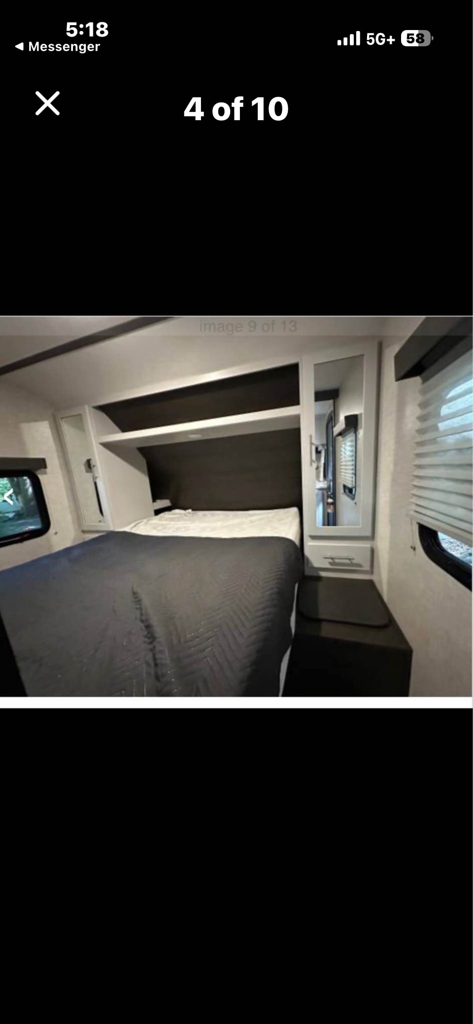 This rv rental features a cozy, modern bedroom. It has a comfortable bed, overhead storage, and a mirrored wardrobe.. Keystone RV Bullet Ultra Lite 2021