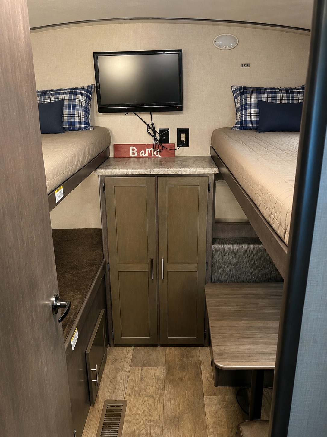 This RV rental features a cozy bunk room with twin bunk beds, a TV, storage, and dinette seating. Great for family trips!. CrossRoads RV Sunset Trail Super Lite 2016