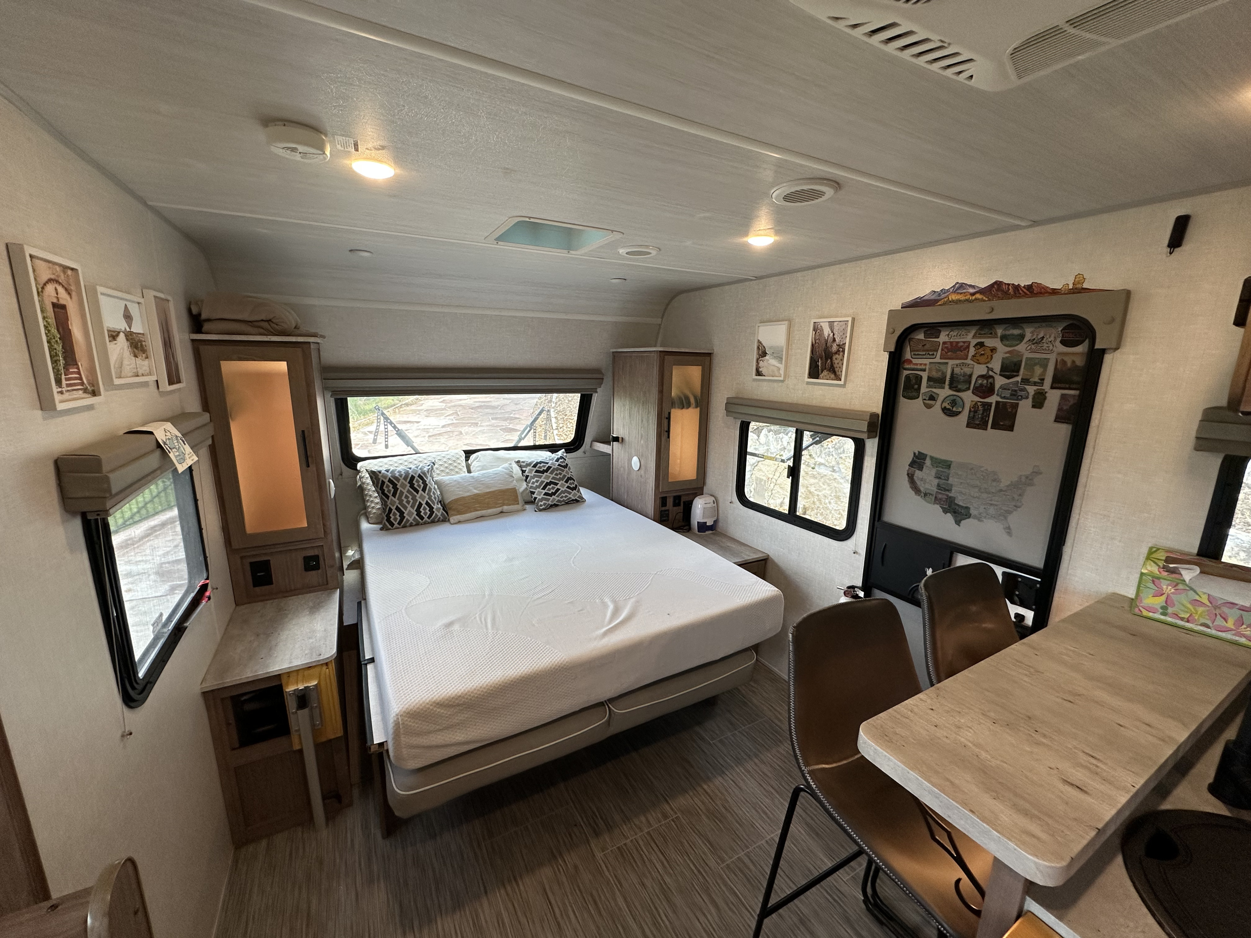 This cozy RV rental features a comfortable bed, dinette, and compact living space, ideal for travel adventures.. No Boundaries 20 2022