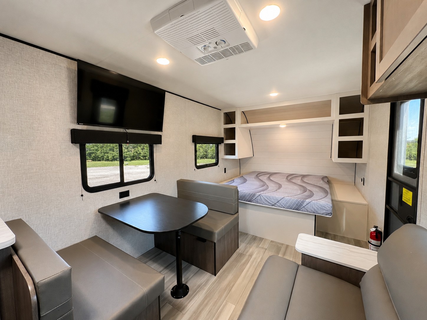 RV rental interior: comfy dinette, TV, bed with storage, and lounge seating for a great road trip.. Starcraft AR-One 2025
