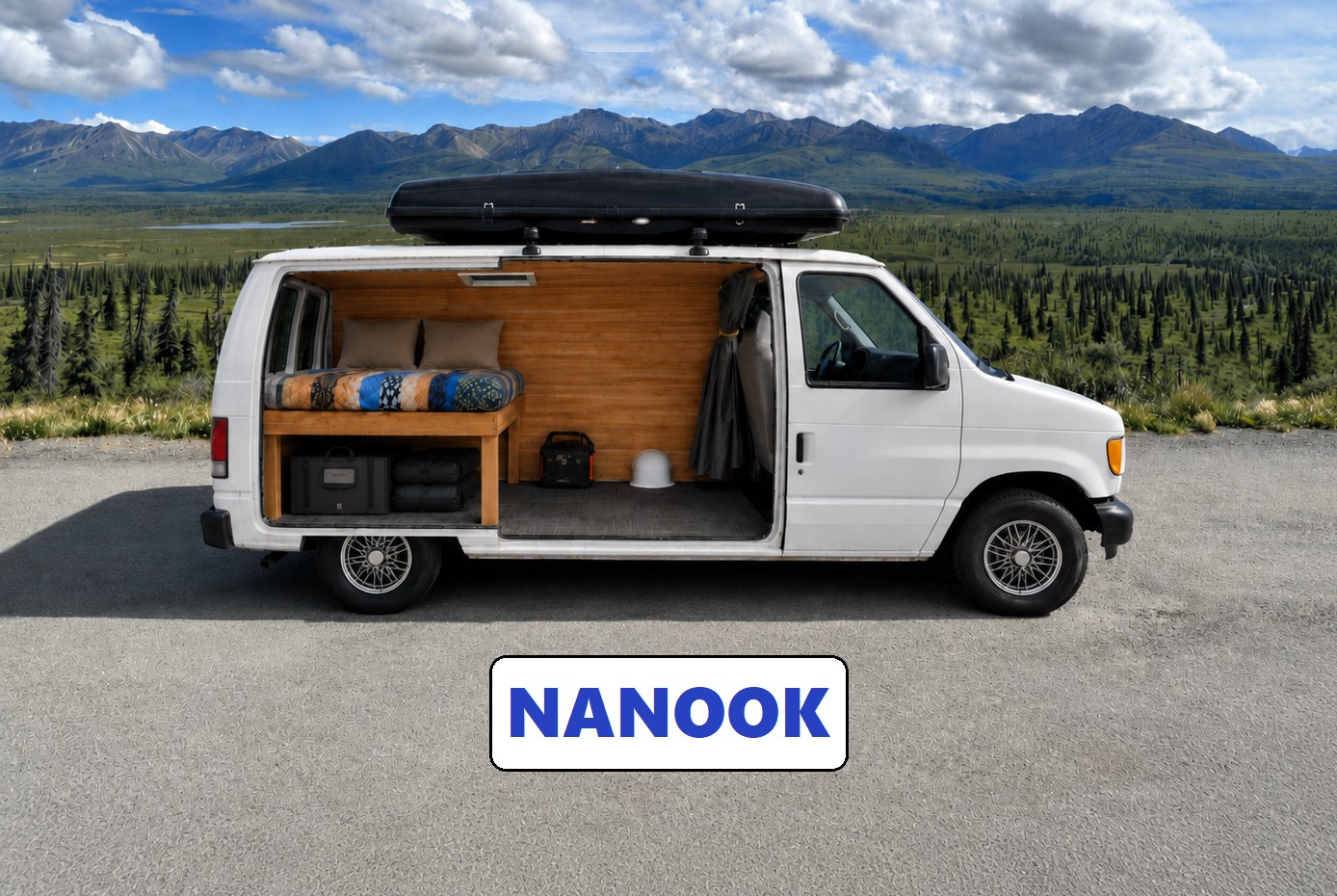 This white rv rental camper van, with its cozy wood interior & bed, is parked overlooking mountains & forests. Perfect for travel!. Ford Econoline 150 1997
