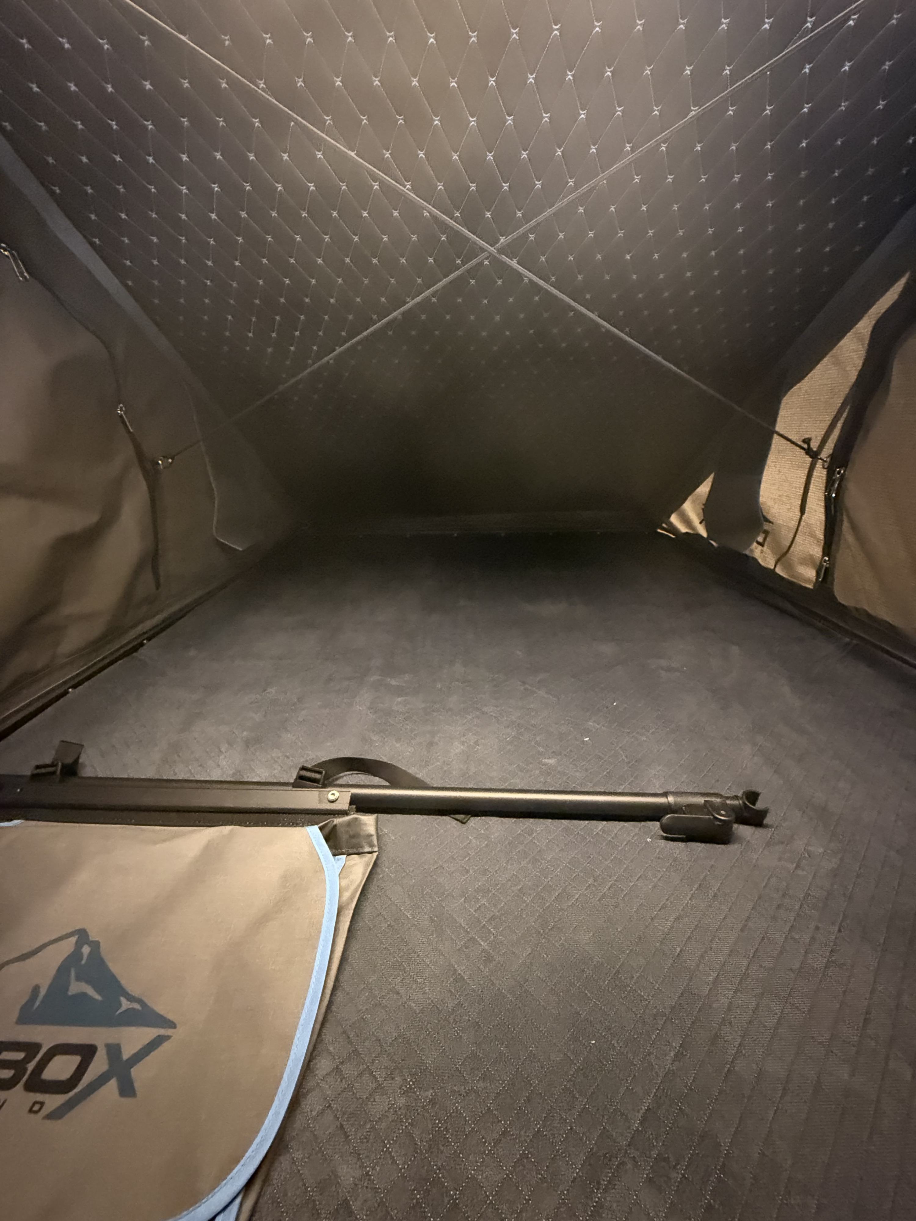 Spacious rooftop tent interior, perfect for rv rental camping. Features quilted comfort, gear storage, and setup pole.. Toyota TOYOTA TUNDRA 2017