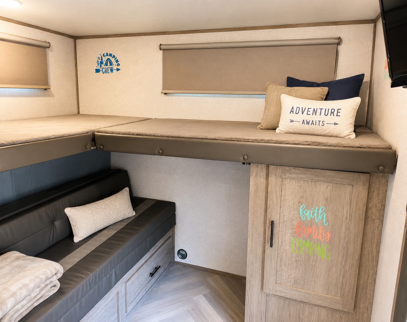 An rv rental's cozy interior, showing two bunk beds above a sofa with storage, decorated for family adventure.. Forest River Salem 2021