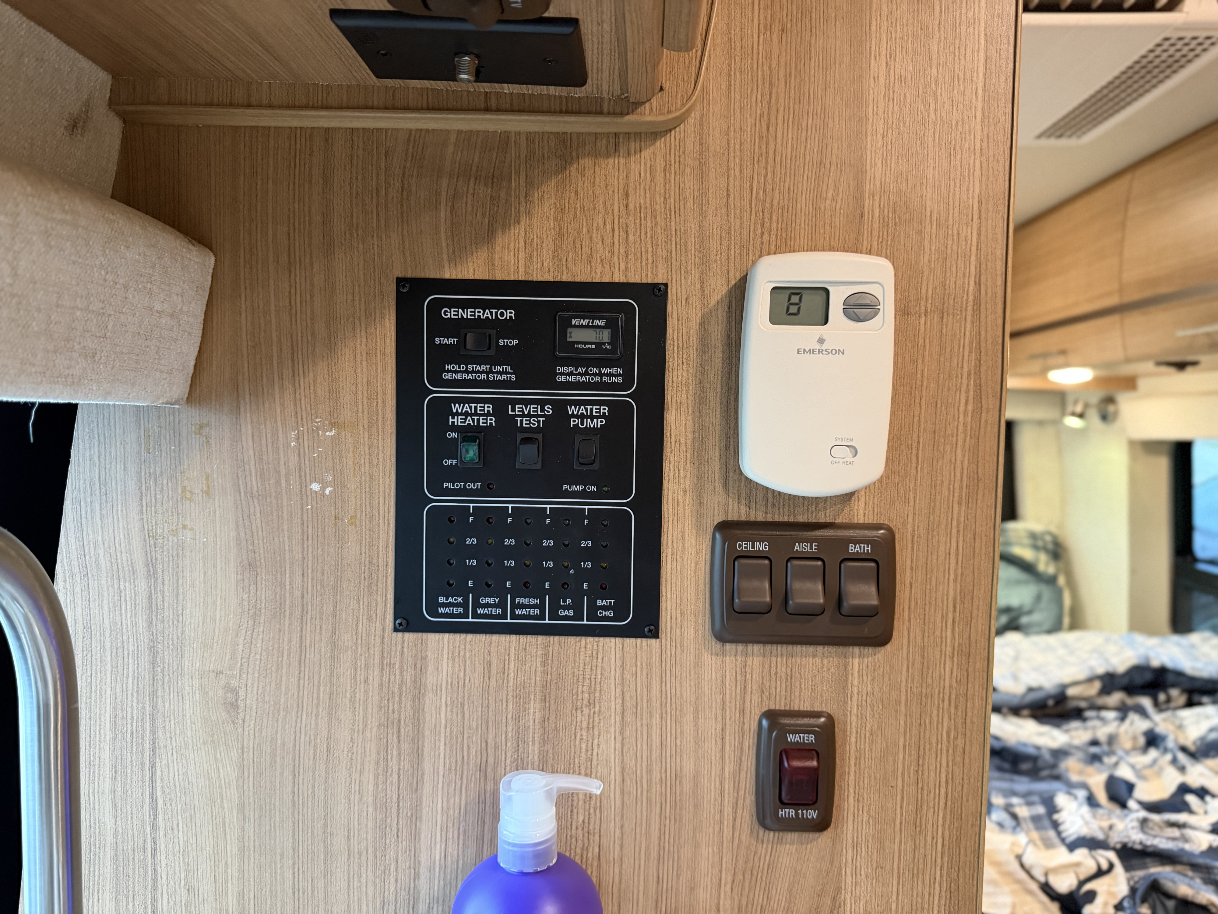 RV rental interior showing the control panel for generator, water tank levels, water heater, pump, thermostat, and lights.. ERA ERA Class B 2013