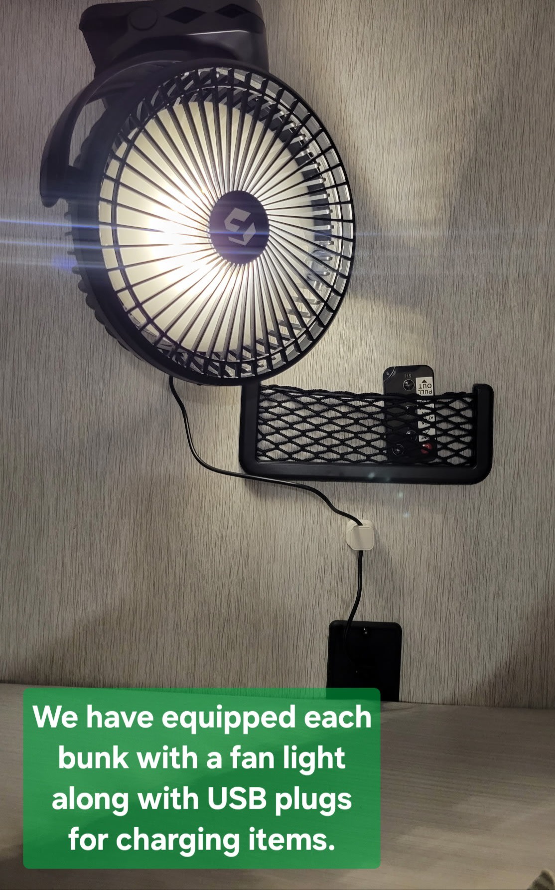 This RV rental bunk features a mounted fan with light, a mesh organizer, and USB charging for convenience.. Forest River Salem Cruise Lite 2023