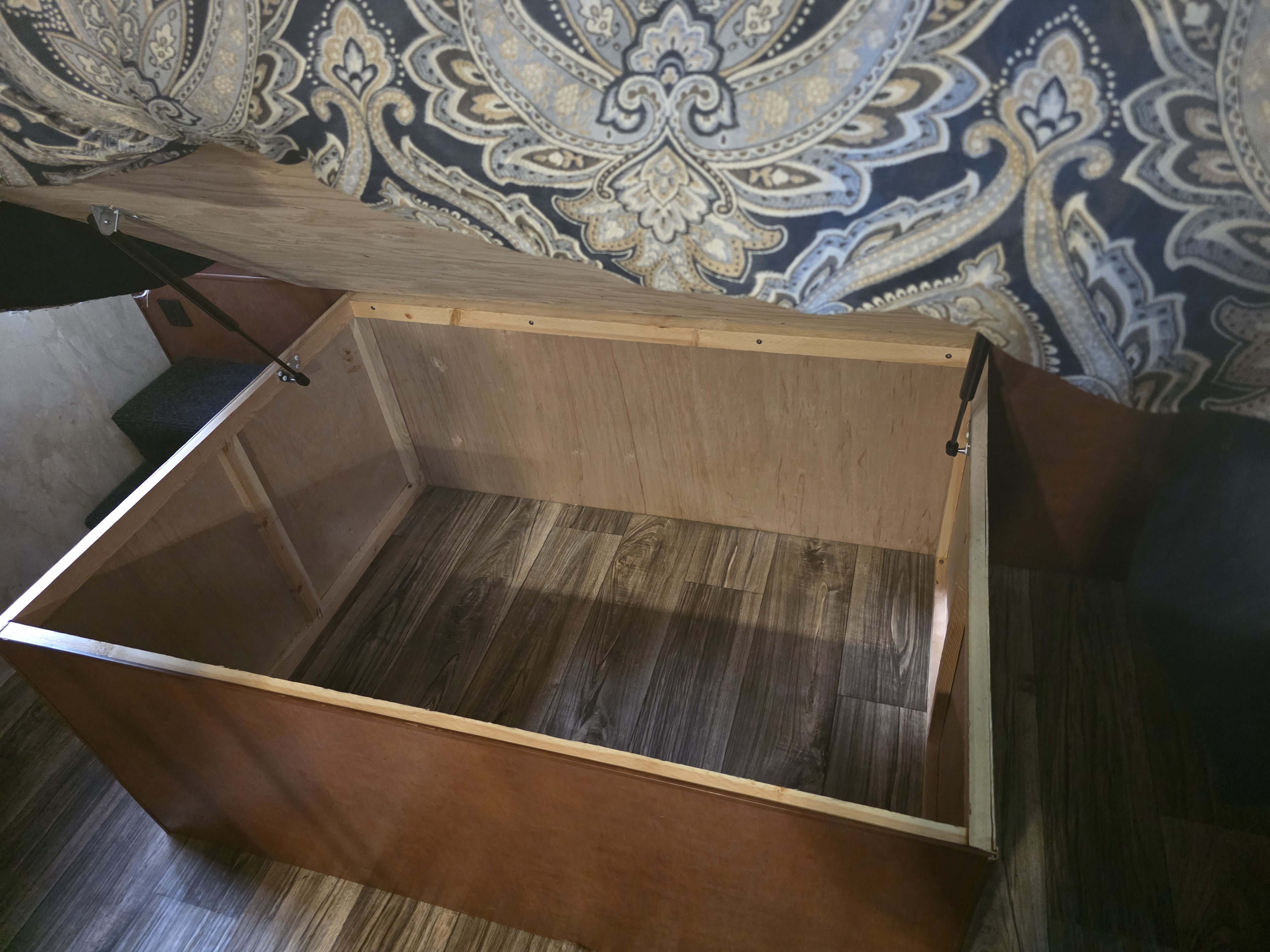 Spacious under-bed storage in an RV rental, kept open by gas struts. Ideal for organizing gear on your travels.. Nash Nash Trailer 2019