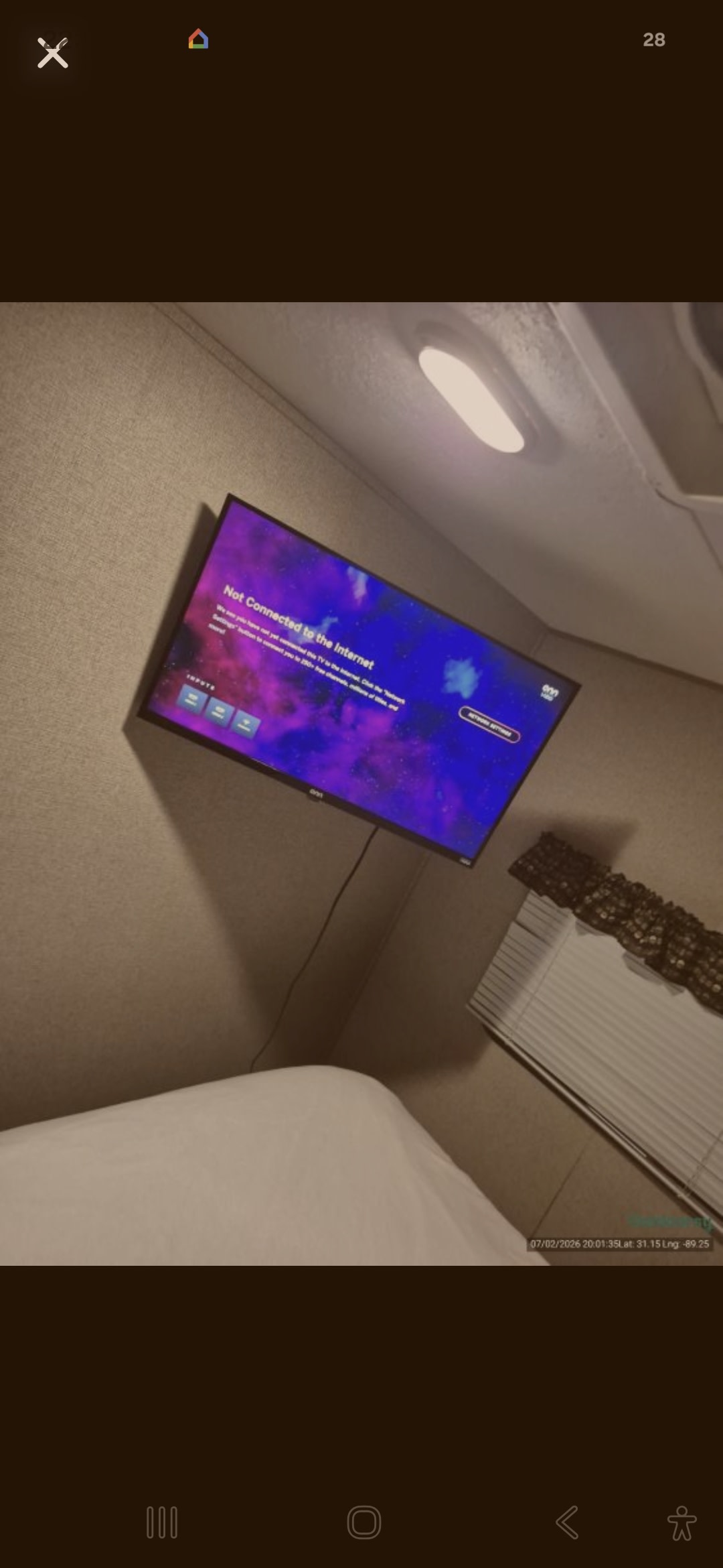 RV rental interior with a TV showing "Not Connected to the Internet," alongside a bed and window blinds.. Keystone RV Summerland 2017