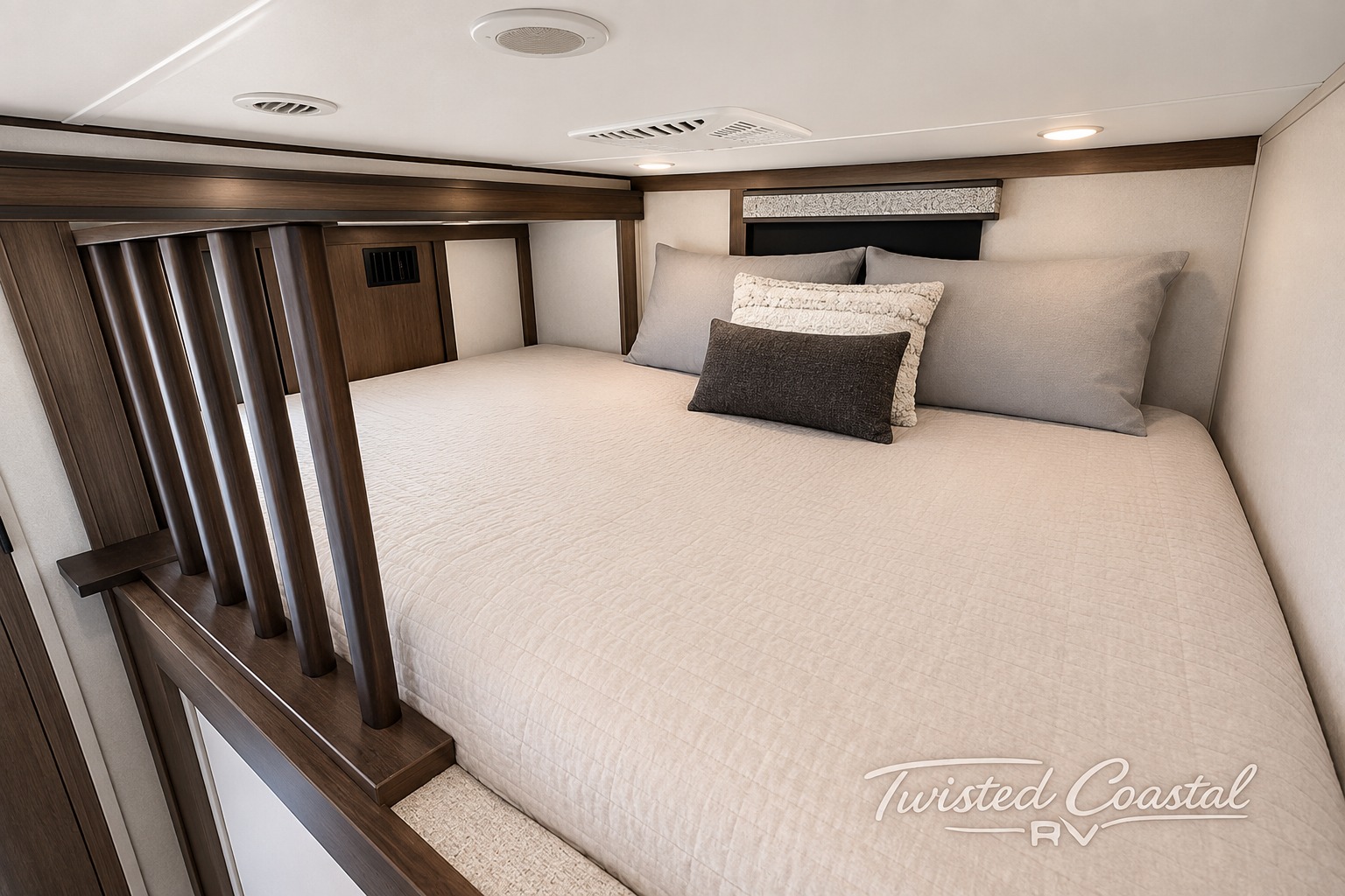 Elevated RV bedroom interior featuring a comfortable bed with neutral bedding and accent pillows, ideal for an rv rental experience.. Alliance RV Paradigm 2022