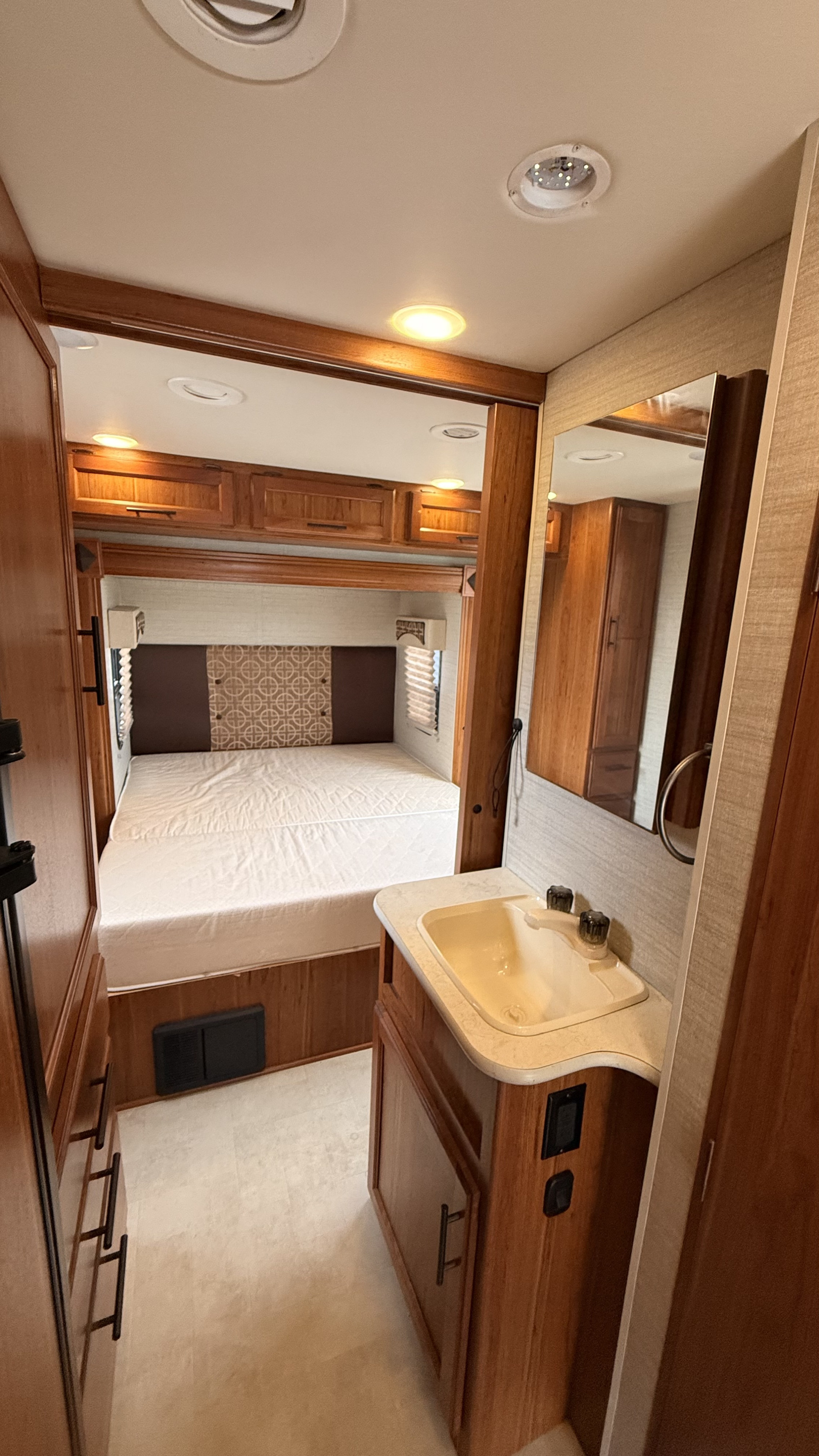 RV rental: Comfortable RV bedroom with a bed & an adjacent vanity sink, ideal for your next trip.. Jayco Melbourne 2017