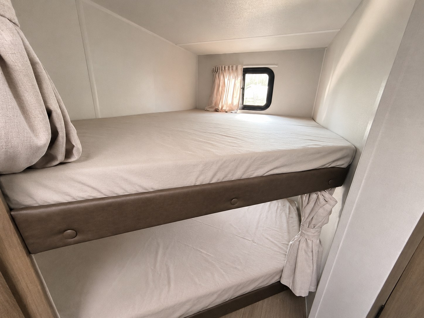 Cozy RV rental bunk beds, perfect for camping adventures and family travel.. Forest River RV EVO 266BHLE 2026