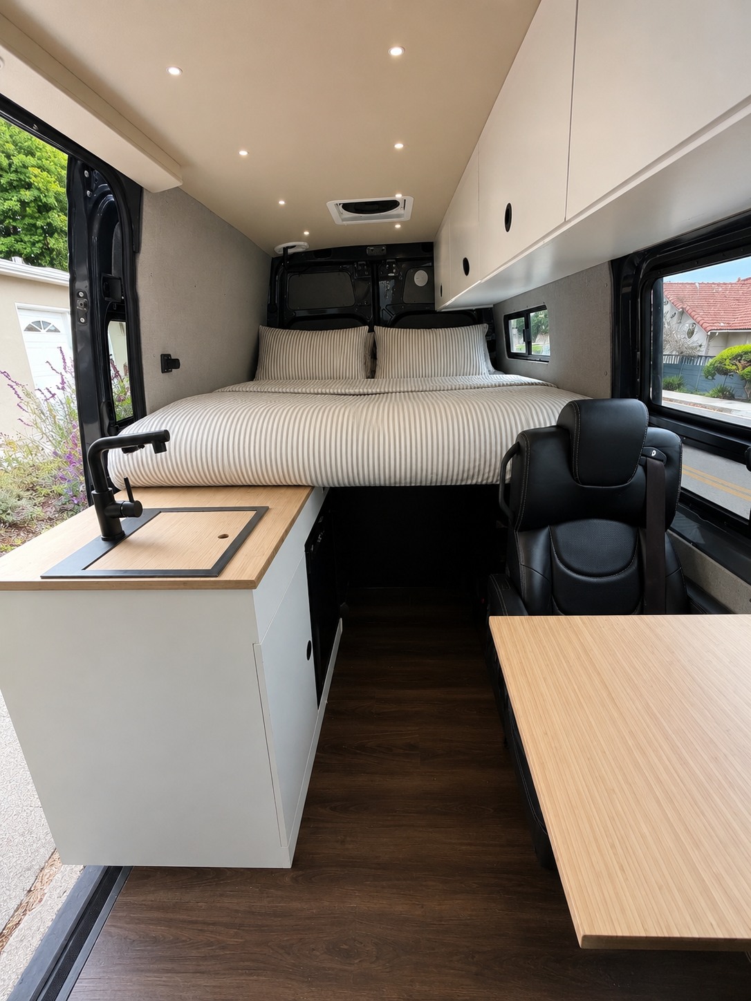 Explore this modern rv rental camper van: a cozy bed, equipped kitchen, and dining space await your adventure.. Mercedes-Benz Sprinter 2019