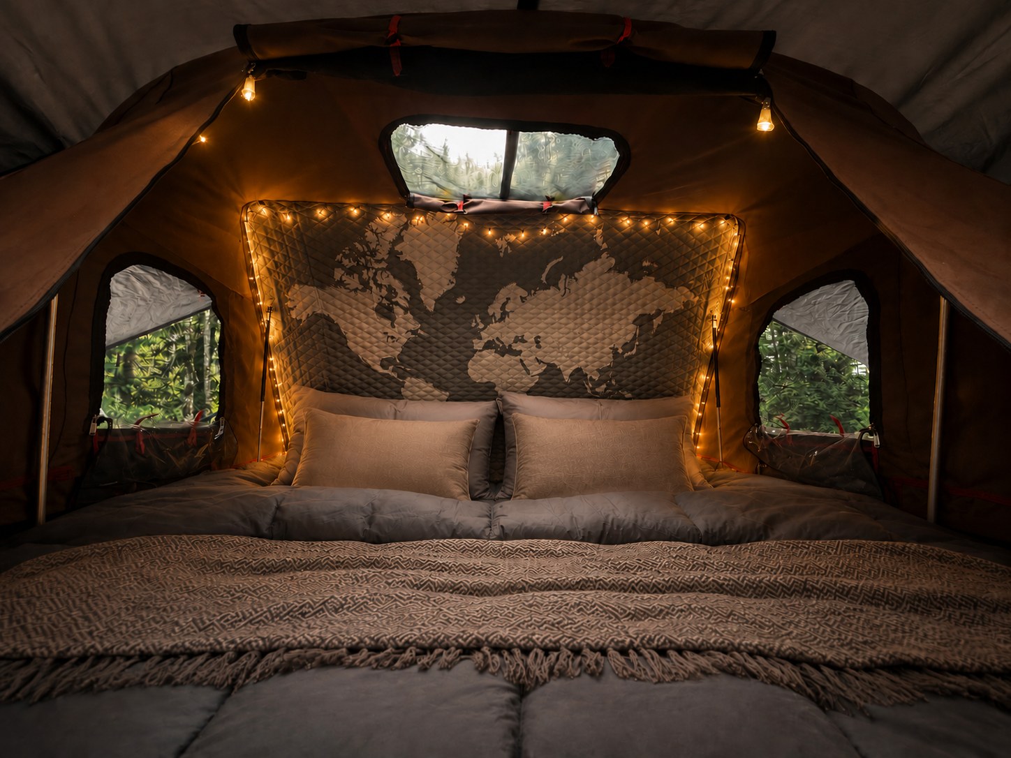 Cozy rv rental retreat: comfy bed, string lights, & world map inside a rooftop tent, offering stunning nature views.. Toyota Land Cruiser 2007