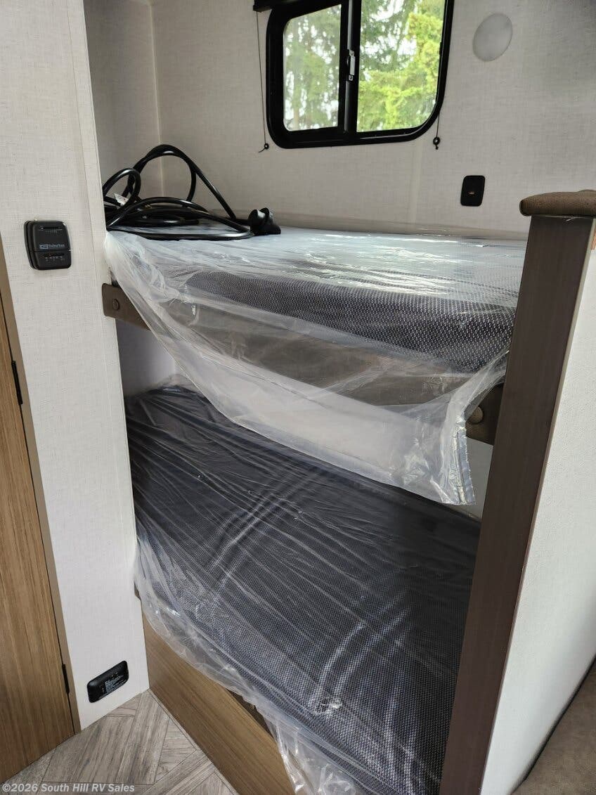 RV rental: Bunk beds with mattresses still in protective plastic, a window, and wall controls. Ready for your trip!. Forest River Salem FSX 2025