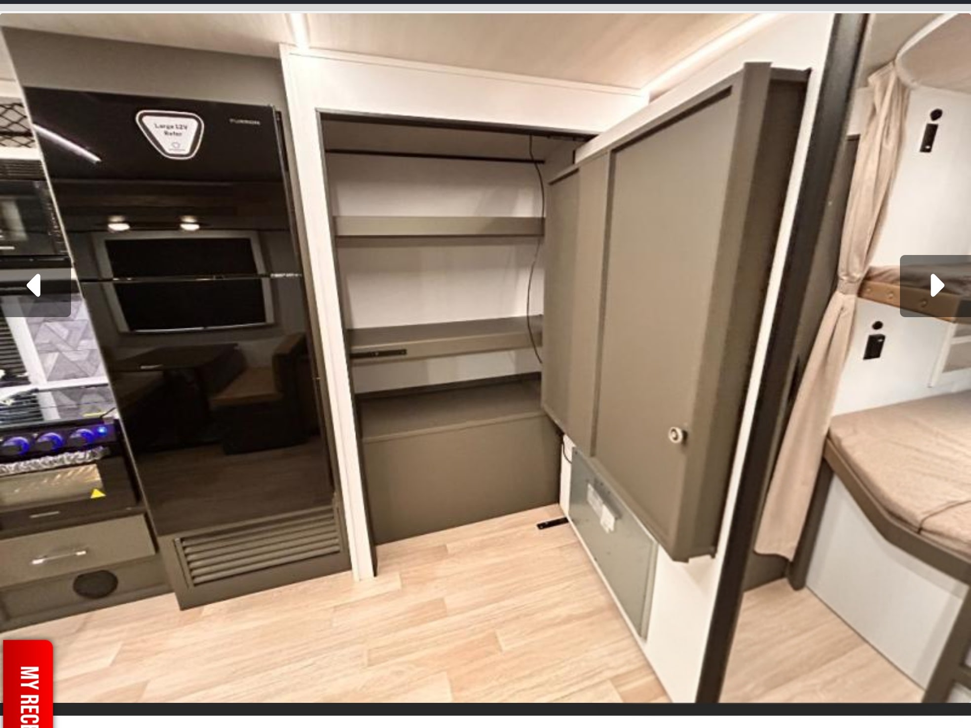 Inside an RV rental: modern kitchen, large 12V fridge, open pantry/storage, and comfortable bunk beds for travel.. Keystone Bullet Crossfire 290BHSWE 2027