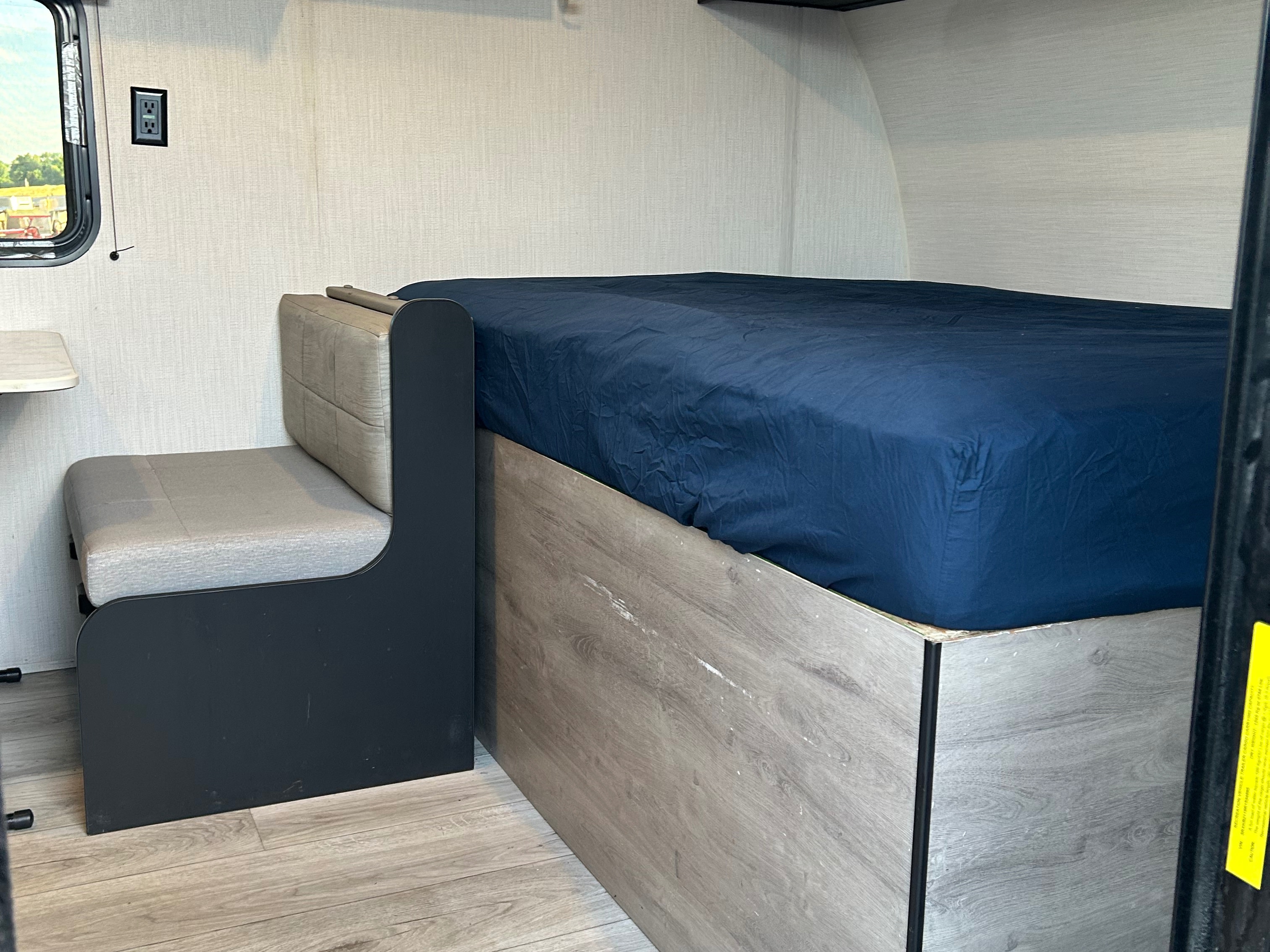 RV rental interior with a cozy bed, seating, and window view. Perfect for road trip comfort.. Cruiser RV A-17BH Avenir 2024