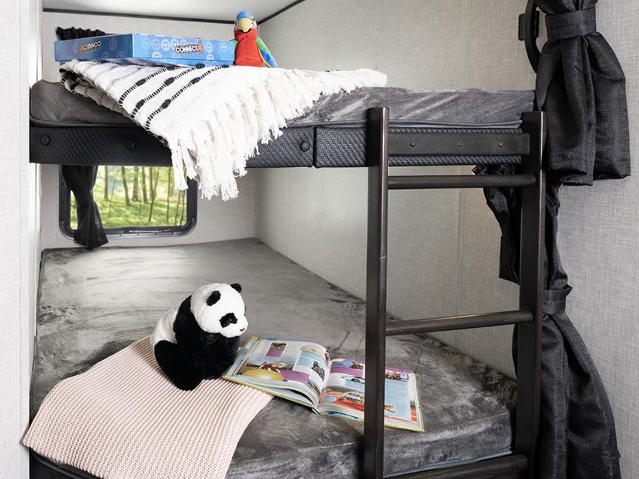 Enjoy family fun in this **rv rental**! Features cozy bunk beds with a nature view, stuffed toys, and games for kids.. Jayco Jay Flight 2024