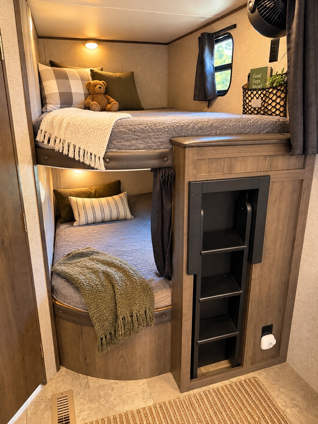 Cozy RV rental bunk beds feature soft bedding, reading lights, a ladder, and modern decor for a comfortable sleeping space.. Jayco Jay Flight 2021
