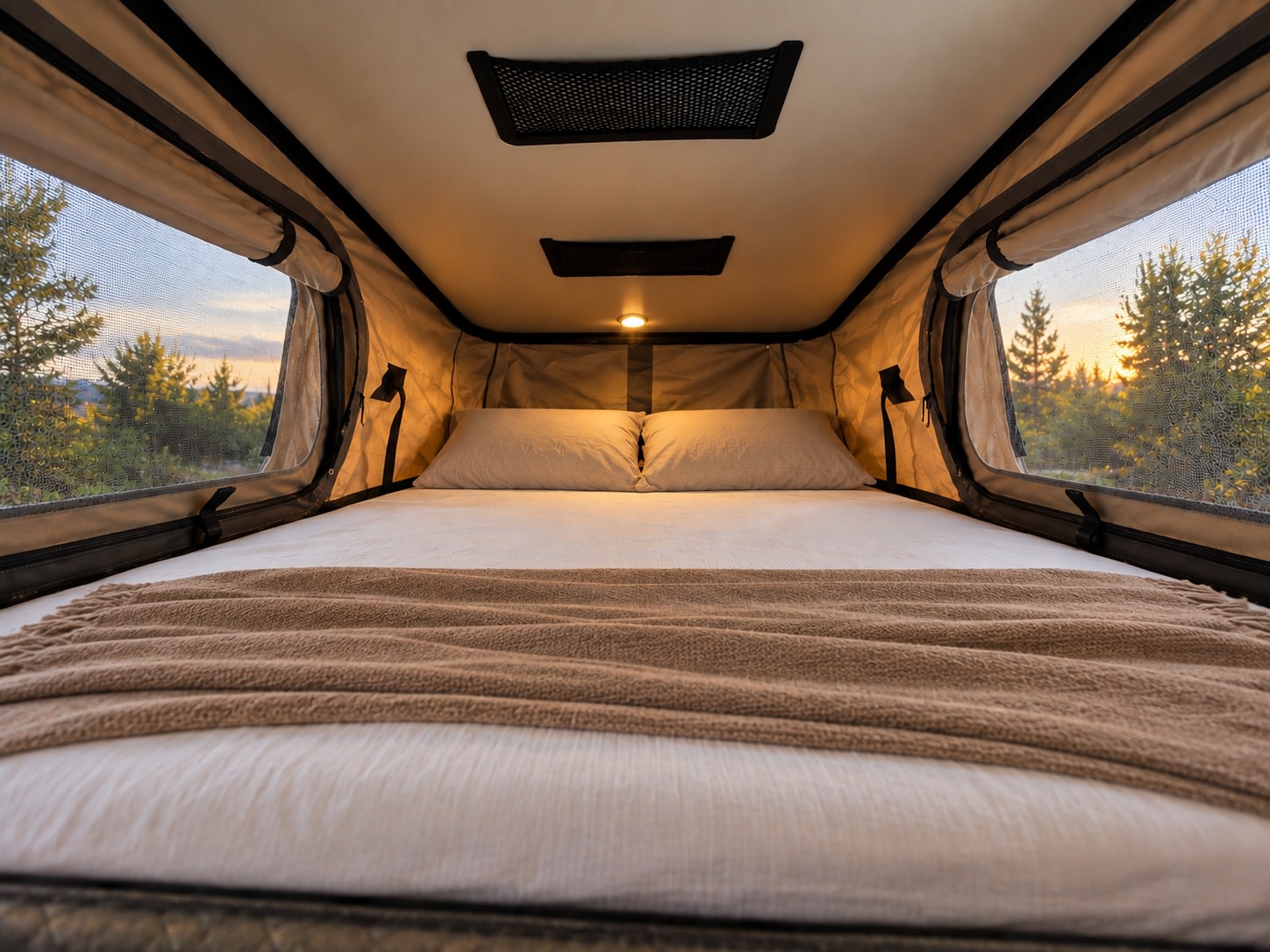 Experience comfort in this RV rental's cozy rooftop tent bed, boasting a beautiful sunset/sunrise forest view.. Winnebago Solis 59P 2027