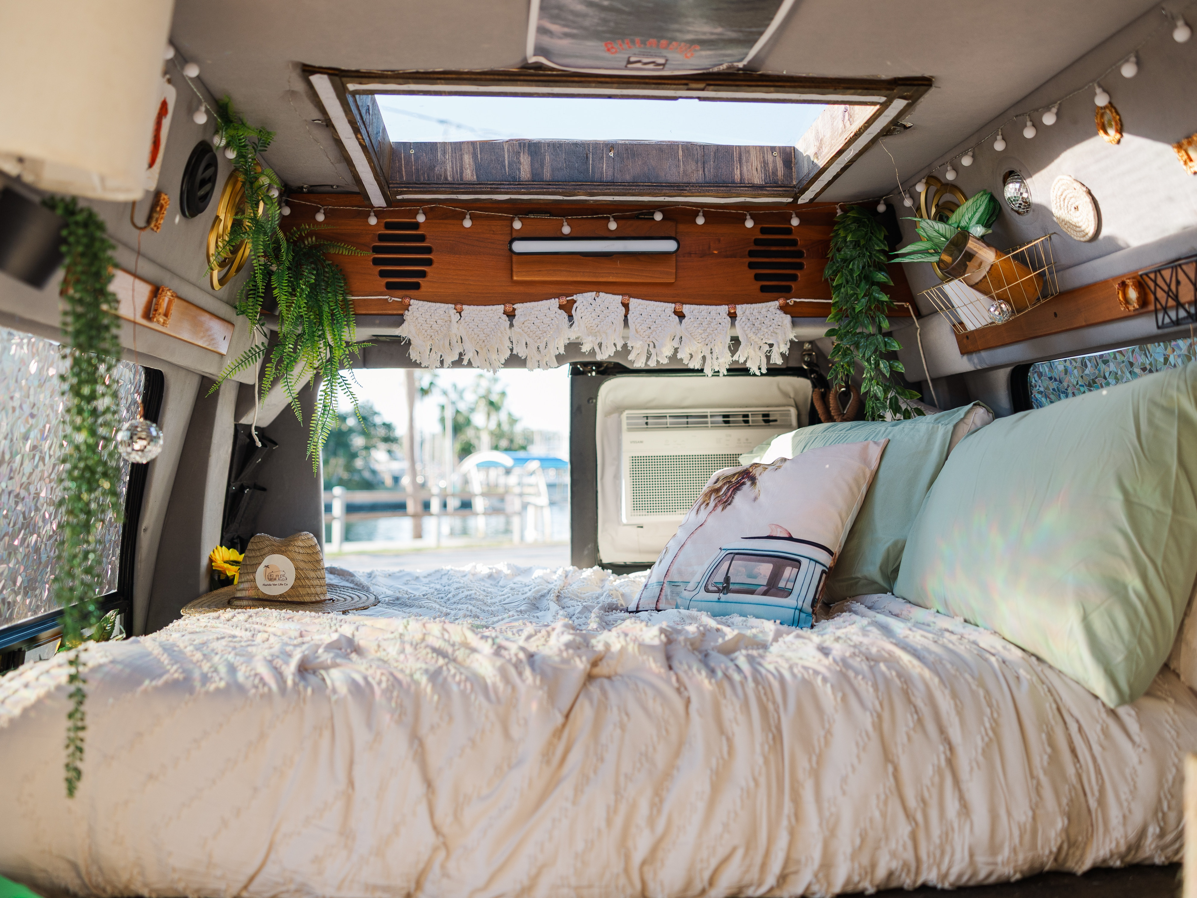 This charming RV rental offers a cozy bed, stylish decor, and a beautiful view, perfect for van life travels.. Dodge Ram 1500 2003
