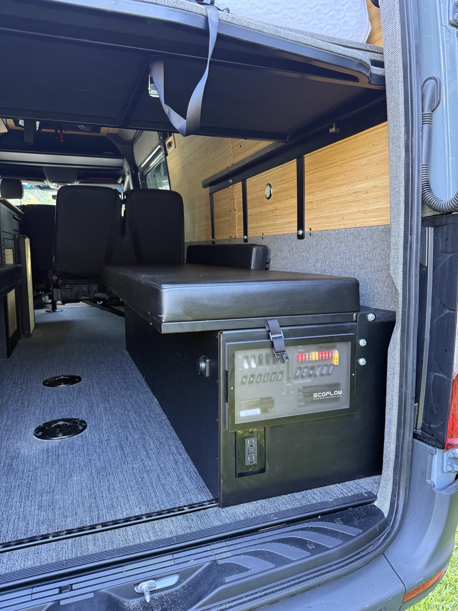 RV rental's adaptable camper van interior: bench with EcoFlow power, rear seats, and storable overhead bed.. Vanworks Switchback 2026