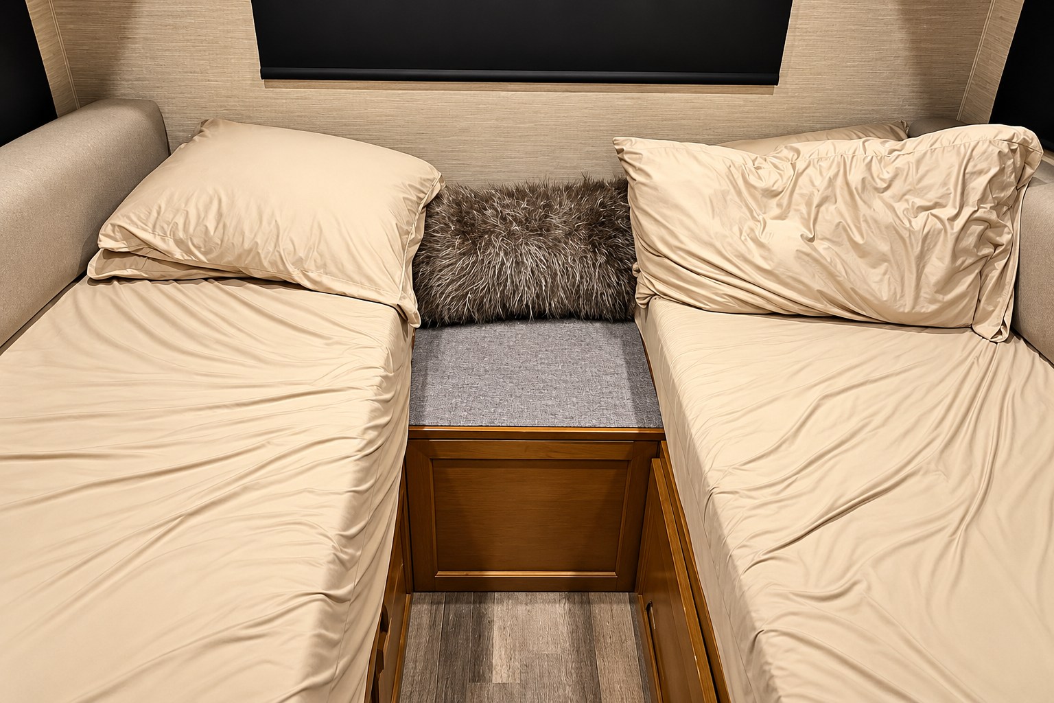 Cozy twin beds in an RV rental, complete with soft beige bedding and storage. Ideal for comfortable travel accommodation.. Tiffin Wayfarer 2020
