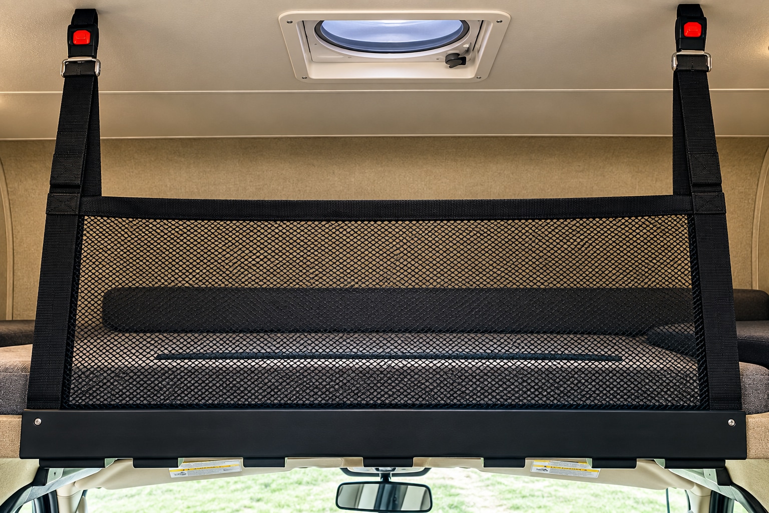 RV rental: Secure cabover bunk with a black mesh safety net, anchored by straps to the ceiling. A ceiling vent is visible.. Forest River Coachmen Freelander 2018