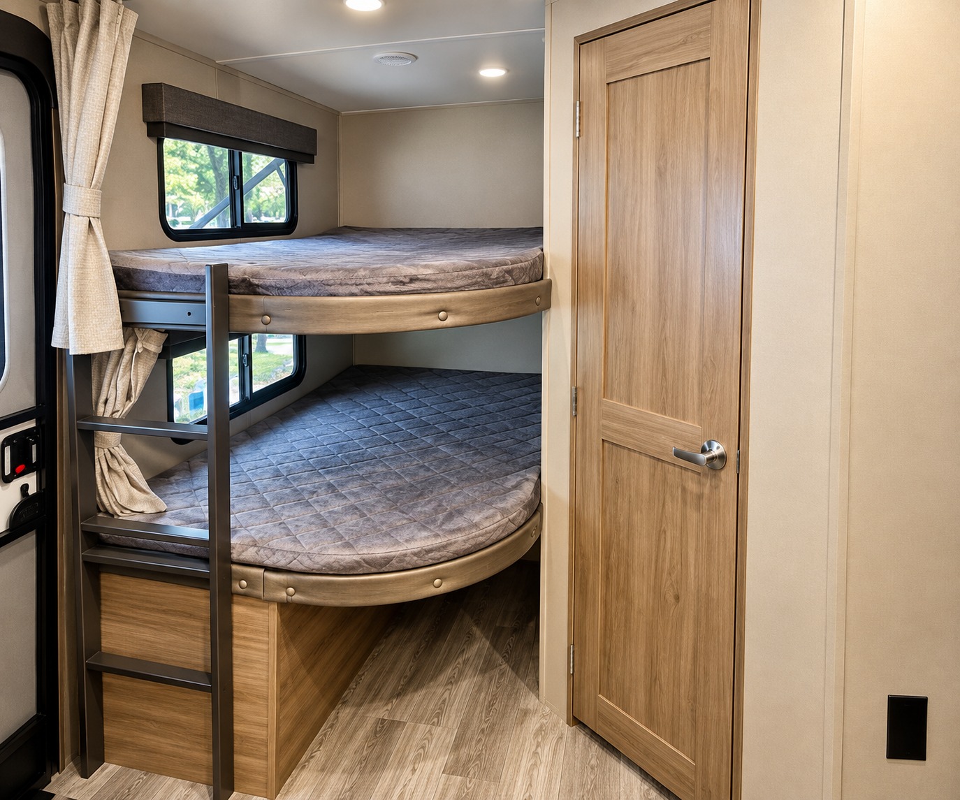 Spacious RV rental interior with cozy bunk beds, complete with a ladder, window views, and an adjacent wood-paneled door.. Grand Design Imagine 2021