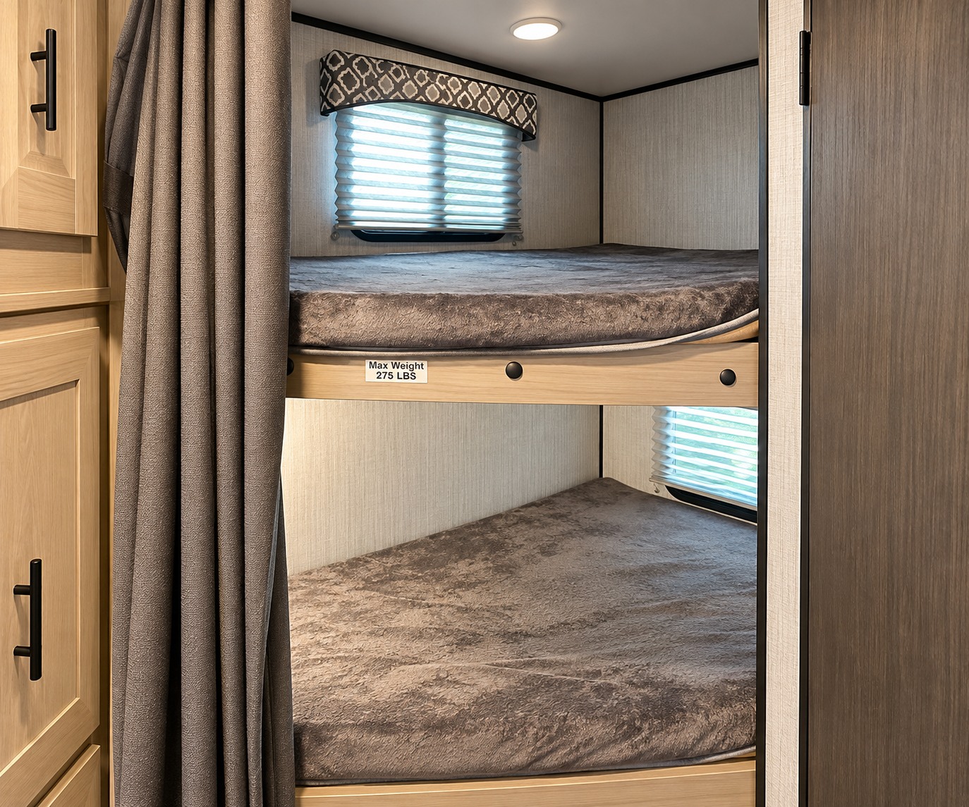 Cozy RV rental bunk beds, featuring plush mattresses and windows. Max weight 275 lbs. Ideal sleeping for trips.. Cruiser RV Radiance Ultra Lite 2020