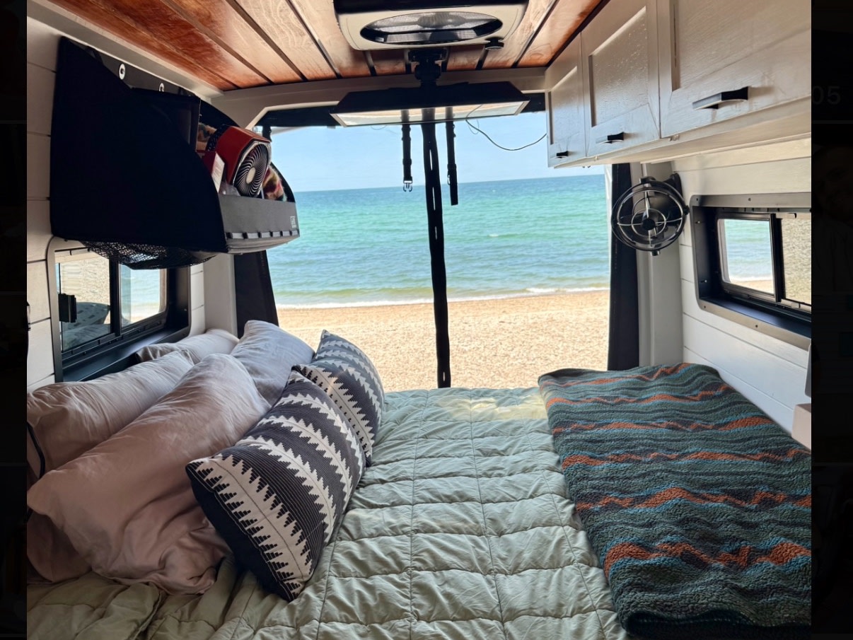 This rv rental offers a cozy bed, storage, and fan, all with a breathtaking view of the sandy beach and ocean. Van life escape!. Mercedes-Benz Sprinter 2020