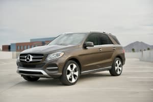 Brown Mercedes-Benz GLE SUV parked on a rooftop