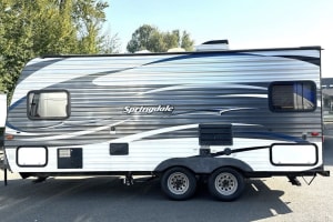 Side view of a modern Springdale travel trailer rv rental