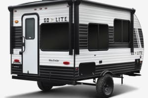 Compact, two-tone travel trailer with off-road tires, perfect for an RV rental adventure