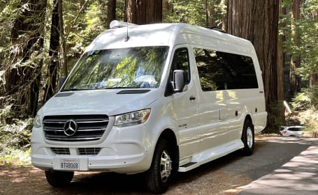 Elegant Mercedes Sprinter RV, 20 MPG, Full Bathroom: Luxurious Travel.