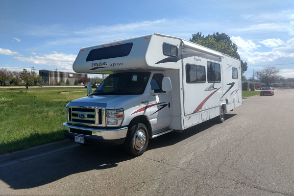 The RV Gypsy is a Class C, 31' motor home that sleeps 8 has windows galore.