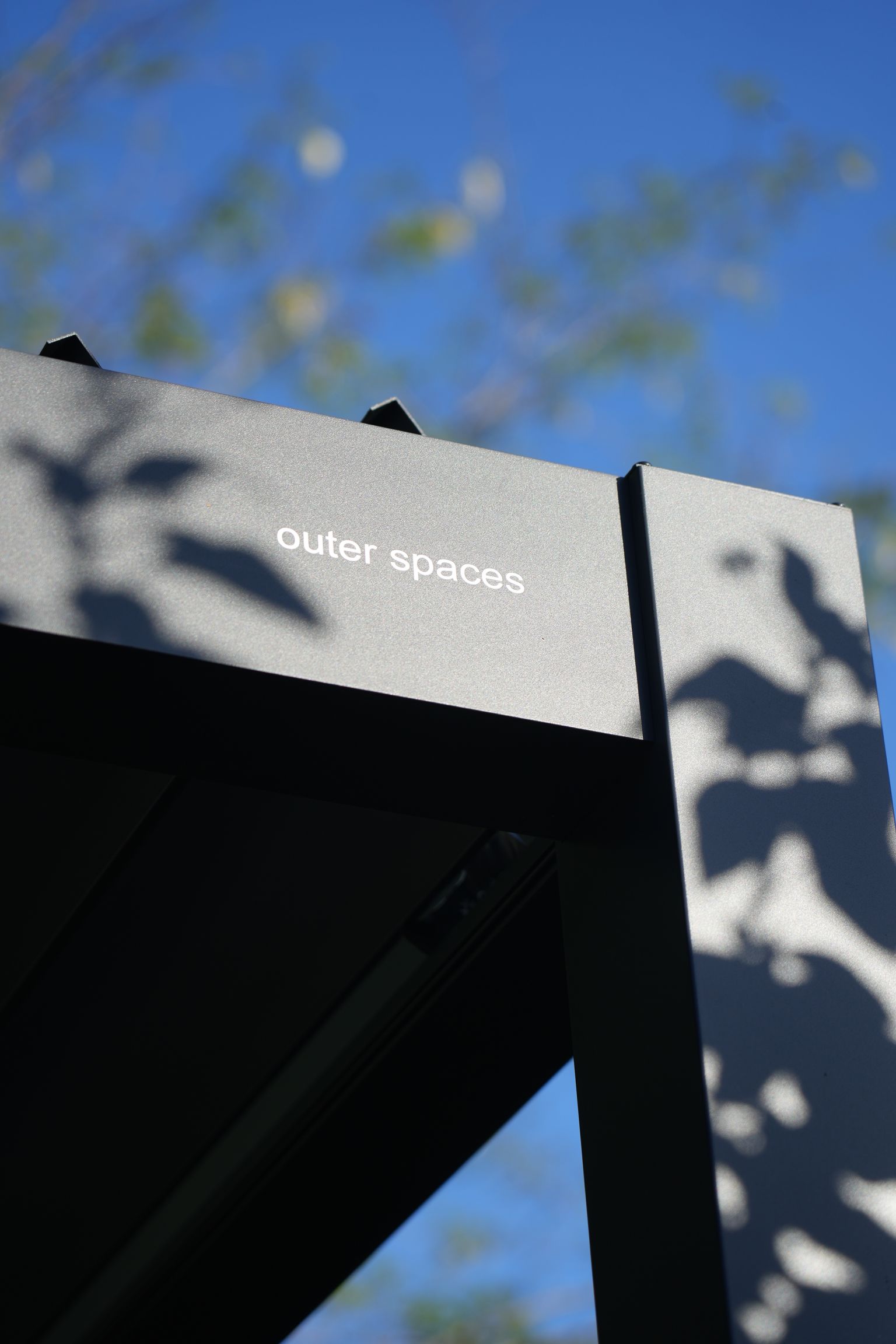 Front view of an Outer Spaces pergola and deck