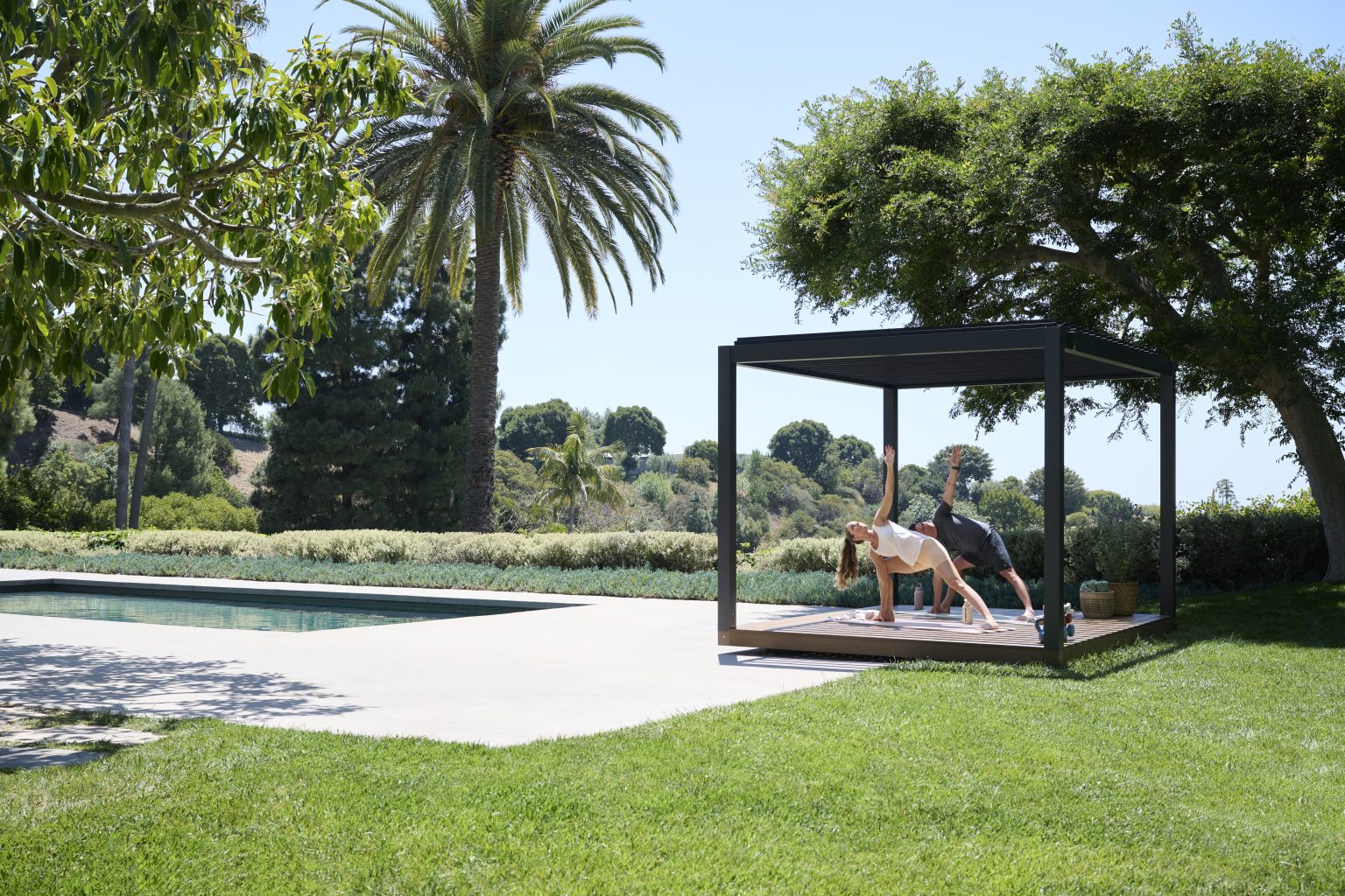 Terry and his wife doing yoga together outdoors