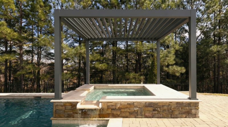 OS1 pergola spanning a raised spa beside a pool in a wooded backyard