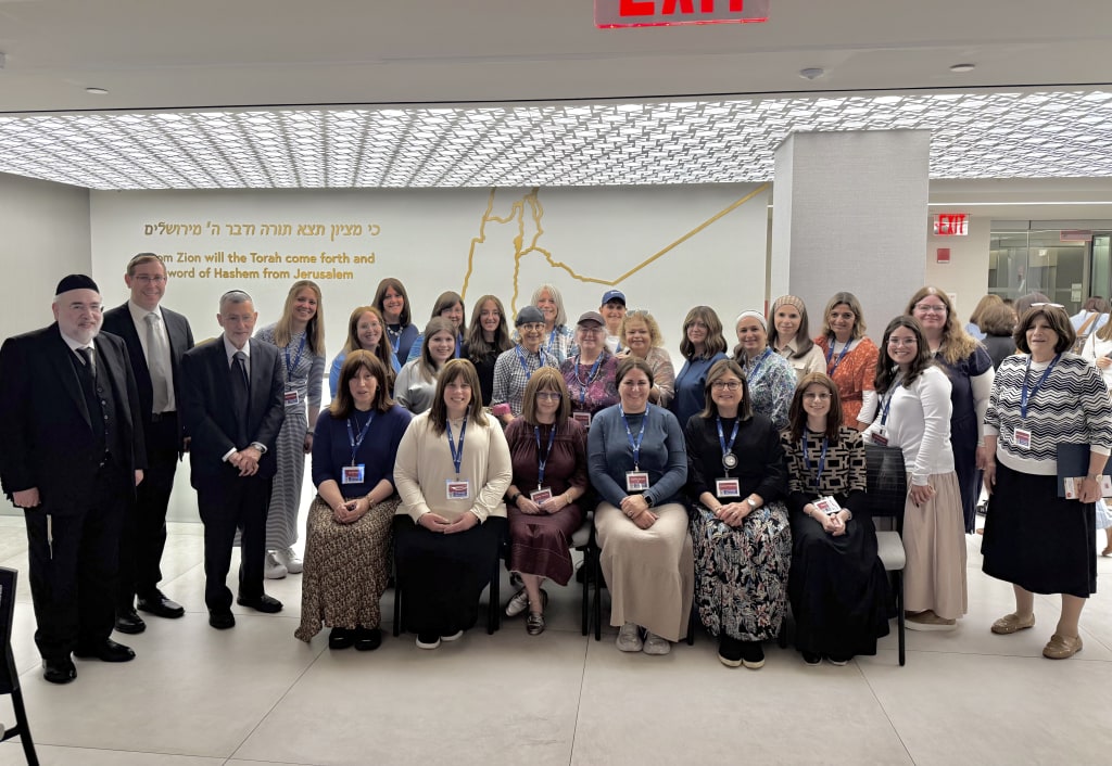 L to R, at the ASK OU 2025 Summer Women's Kashrus Experience: OU Kosher ‘s Chief Operating Officer Rabbi Moshe Elefant; Managing Director of Community Relations Rabbi Eli Eleff; and Chief Executive Officer Rabbi Menachem Genack, with a group of seminar participants.