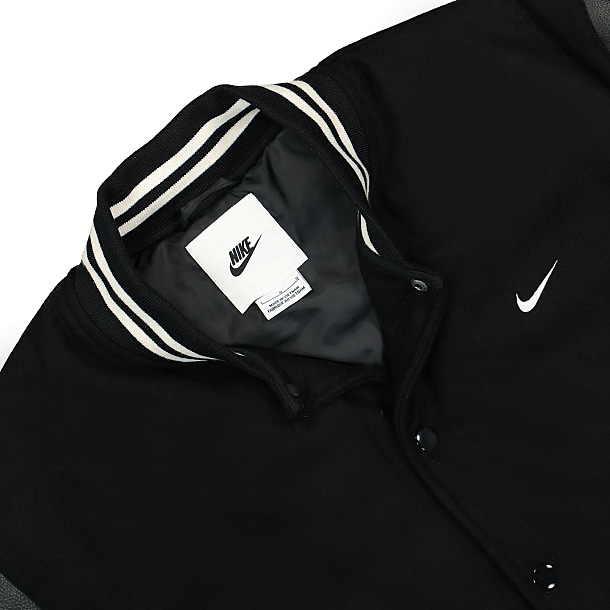 Nike unisex retro collegiate varsity jacket in black and white